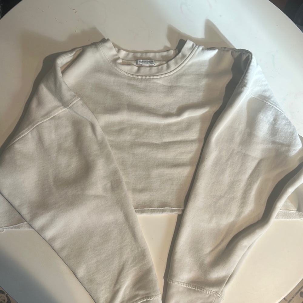 We wore what cream cropped sweat shirt